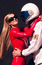 PARIS HILTON in a Tight Red Catsuit Dressed as Britney Spears in Oops I Did It Again 10/27/2025
