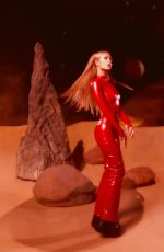 PARIS HILTON in a Tight Red Catsuit Dressed as Britney Spears in Oops I Did It Again 10/27/2025