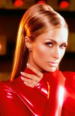 PARIS HILTON in a Tight Red Catsuit Dressed as Britney Spears in Oops I Did It Again 10/27/2025