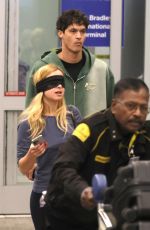 ADDISON RAE Wears a Blindfold at LAX Airport in Los Angeles 11/19/2025