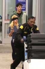 ADDISON RAE Wears a Blindfold at LAX Airport in Los Angeles 11/19/2025