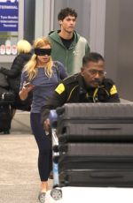 ADDISON RAE Wears a Blindfold at LAX Airport in Los Angeles 11/19/2025