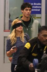 ADDISON RAE Wears a Blindfold at LAX Airport in Los Angeles 11/19/2025