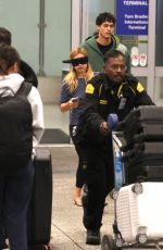 ADDISON RAE Wears a Blindfold at LAX Airport in Los Angeles 11/19/2025