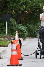 GISELE BUNDCHEN Out with Her Baby and Dog in Miami 11/17/2025