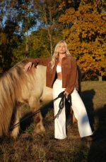 KATIE SIGMOND at a Photoshoot, October 2025
