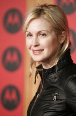KELLY RUTHERFORD at Motorola 6th Anniversary Holiday Party in Los Angeles 12/02/2004