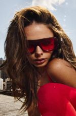 MEIKA WOOLARD at a Photoshoot, September 2025