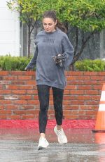 MILA KUNIS Sports Taylor Swift Tour Sweatshirt Out in Los Angeles 11/17/2025