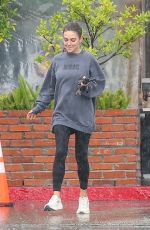 MILA KUNIS Sports Taylor Swift Tour Sweatshirt Out in Los Angeles 11/17/2025