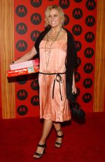 NICOLE EGGERT at Motorola 6th Anniversary Holiday Party in Los Angeles 12/02/2004