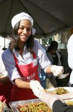 ZOE SALDANA at Thanksgiving Lunch for Homeless in Los Angeles 11/25/2009