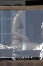 JENNIFER ANISTON in Bikini at Her Home in Los Angeles 12/19/2025