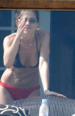 JENNIFER ANISTON in Bikini at Her Home in Los Angeles 12/19/2025