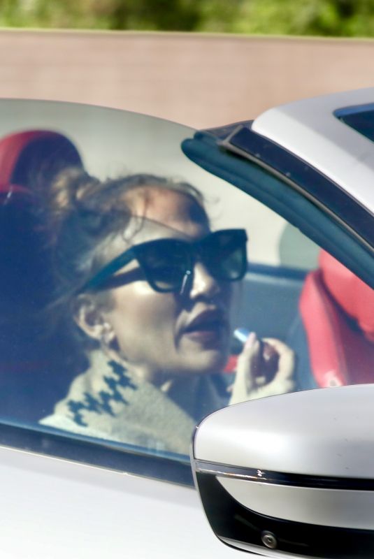 JENNIFER LOPEZ Touches Up Her Makeup While Stuck in Traffic in Los Angeles 12/23/2025