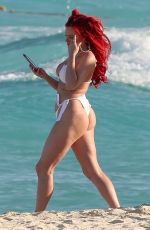 JUSTINA VALENTINE in Bikini at a Beach in Cancun 03/20/2019