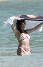 HEIDI KLUM in Bikini at a Beach in St Barths 12/28/2025