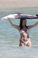 HEIDI KLUM in Bikini at a Beach in St Barths 12/28/2025