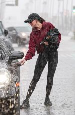 DAKOTA JOHNSON Leaves Gym During a Heavy Downpour in Los Angeles 02/16/2026
