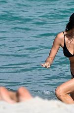 IRINA SHAYK in Bikini at a Beach in Miami 02/15/2026