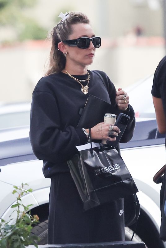 MILEY CYRUS Out Shopping at XIV Karats Jewelry Store in Beverly Hills 02/11/2026