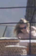 OLIVIA WILDE in Bikini at a Beach in Mexico 02/11/2026