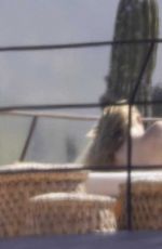 OLIVIA WILDE in Bikini at a Beach in Mexico 02/11/2026