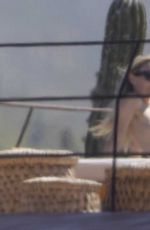 OLIVIA WILDE in Bikini at a Beach in Mexico 02/11/2026