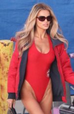BROOKS NADER in a Red Swimsuit on the Set of Baywatch Reboot at Venice Beach 03/19/2026