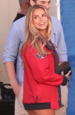 BROOKS NADER in a Red Swimsuit on the Set of Baywatch Reboot at Venice Beach 03/19/2026