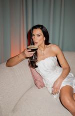 DUA LIPA at a Photoshoot 03/19/2026