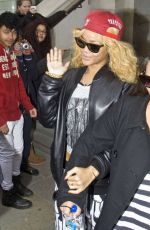 RIHANNA Leaves Her London Hotel and Posing with Fans 02/18/2012