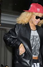 RIHANNA Leaves Her London Hotel and Posing with Fans 02/18/2012