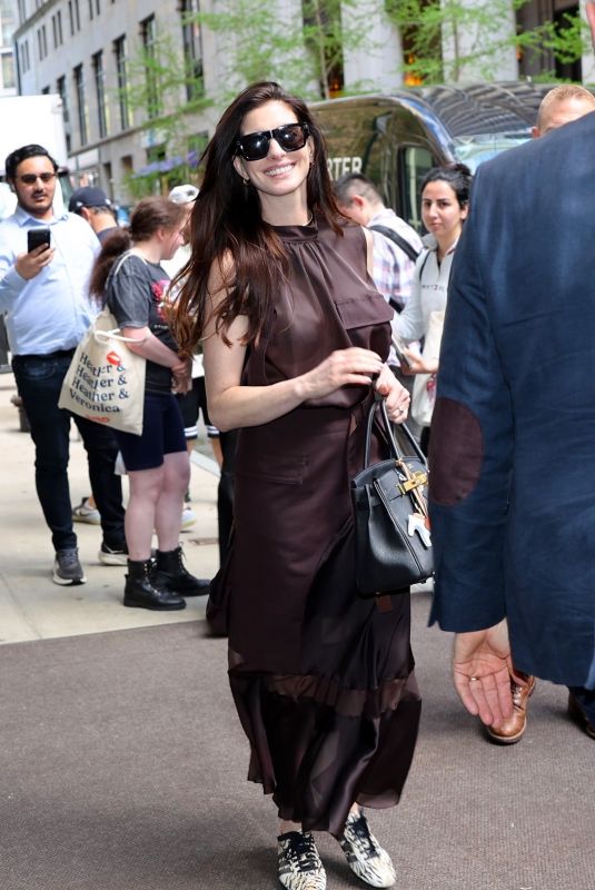ANNE HATHAWAY Leaves Her Hotel in New York City 04/17/2026