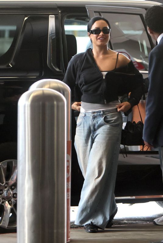 DEMI LOVATO Arrives at LAX Airport in Los Angeles 04/12/2026
