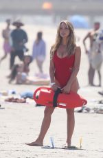 HASSIE HARRISON in a Red Swimsuit Filming Scenes for Baywatch Reboot in Los Angeles 04/22/2026