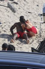SHAY MITCHELL in a Red Swimsuit Films Scenes for Baywatch Reboot at Leo Carrillo Beach in Malibu 04/08/2026