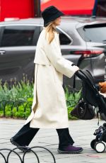 JENNIFER LAWRENCE Dons a Trenchcoat for a Stroller Stroll in New York City 04/30/2026