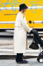 JENNIFER LAWRENCE Dons a Trenchcoat for a Stroller Stroll in New York City 04/30/2026