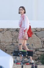 LILY COLLINS on the Set of Emily in Paris at Mykonos in Greece 05/20/2026