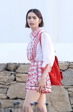 LILY COLLINS on the Set of Emily in Paris at Mykonos in Greece 05/20/2026