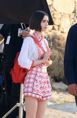 LILY COLLINS on the Set of Emily in Paris at Mykonos in Greece 05/20/2026