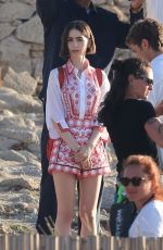 LILY COLLINS on the Set of Emily in Paris at Mykonos in Greece 05/20/2026