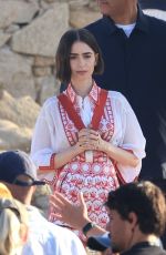 LILY COLLINS on the Set of Emily in Paris at Mykonos in Greece 05/20/2026