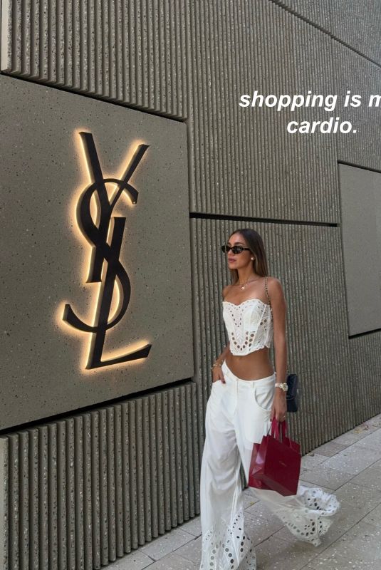 LUANA BARRON Promotes Saint Laurent in a White Dress Out in Miami 05/12/2026