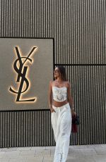 LUANA BARRON Promotes Saint Laurent in a White Dress Out in Miami 05/12/2026