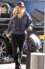 ELLIE GOULDING and Beau Minniear Jet Out of London Ahead of Taylor Swift