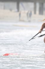 HASSIE HARRISON in a Red Swimsuit on the Set of Baywatch Reboot in Los Angeles 06/30/2026