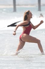 HASSIE HARRISON in a Red Swimsuit on the Set of Baywatch Reboot in Los Angeles 06/30/2026