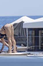 MICHELLE HUNZIKER in Bikini Doing Yoga at a Boat at Aeolian Islands 07/15/2026